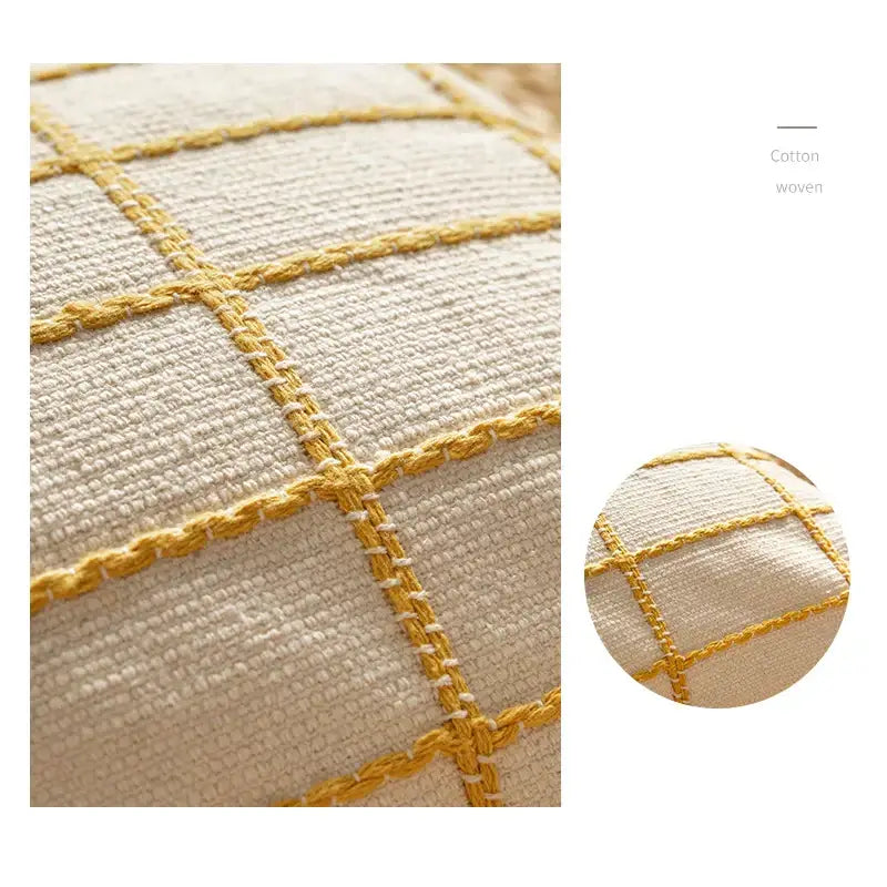 Cream-colored decorbites cotton woven cushion cover with golden yellow stitched grid pattern for living room decor