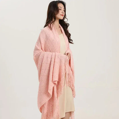 A soft pink decorbites knitted diamond shawl wrap with fringed edges for cozy bedroom decor and style