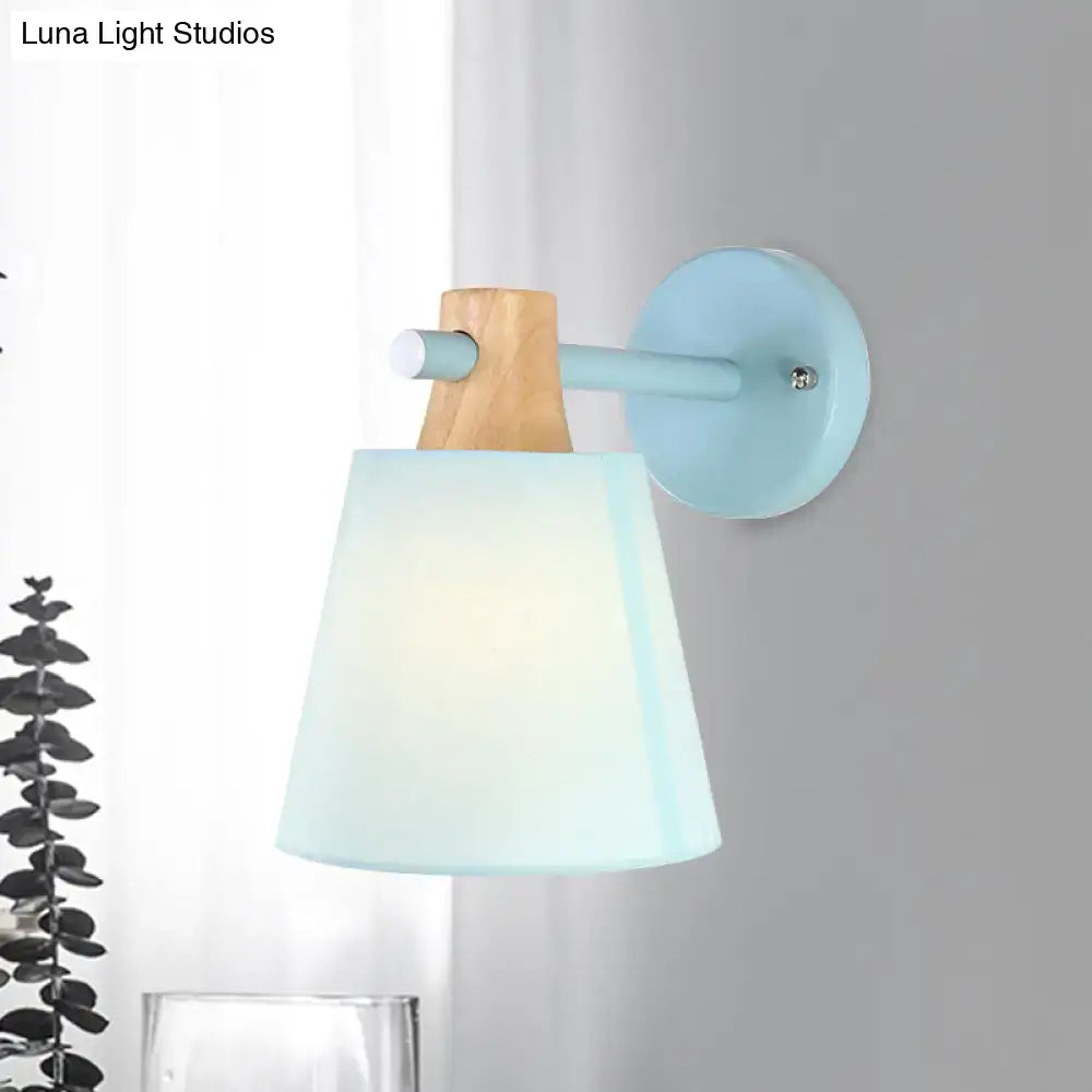 Yellow macaron fabric wall light with wood accent features a blue metal base and translucent macaron fabric shade for e26 e27 bulbs