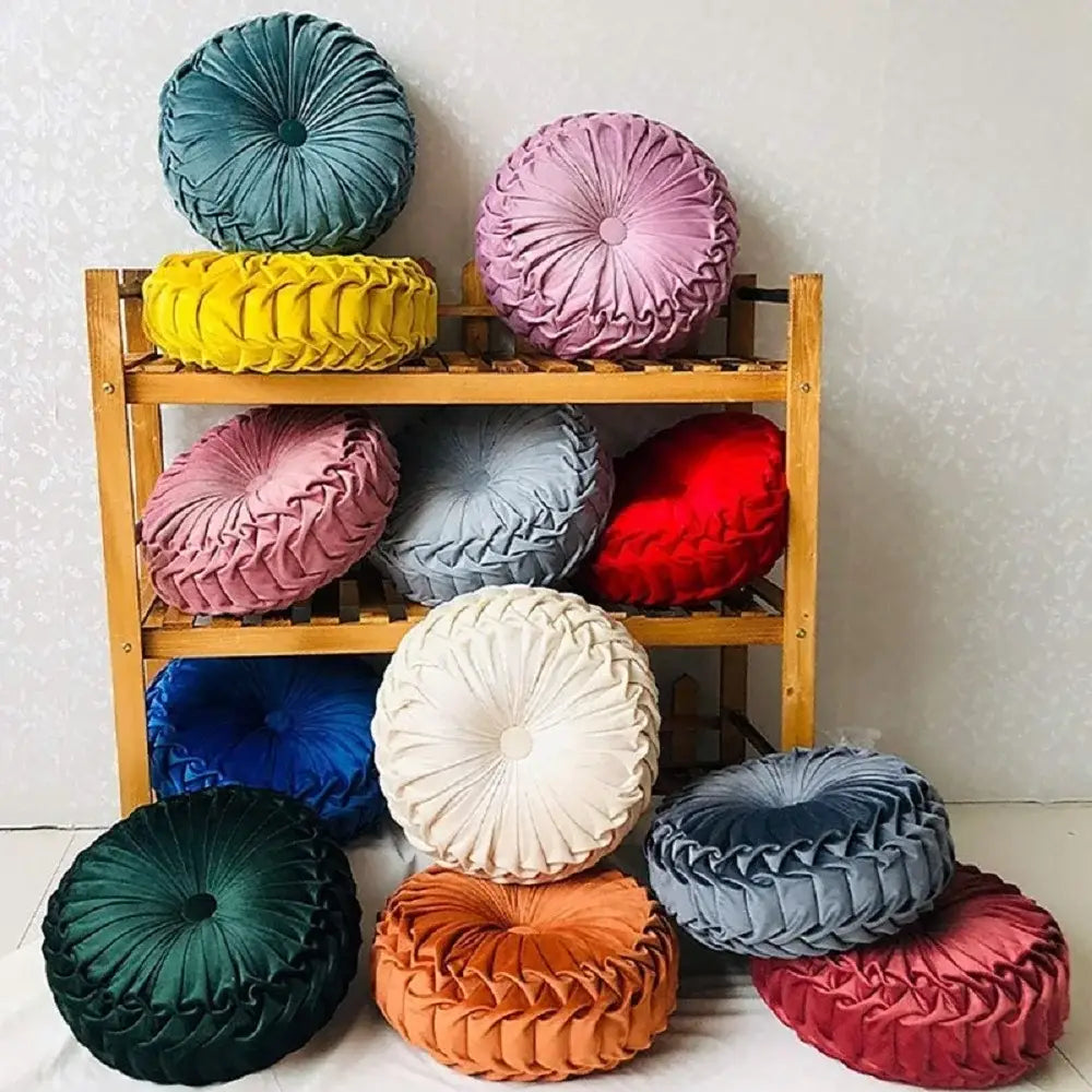 A collection of vibrant plush round throw pillows including a yellow pleated velvet pillow for living room decorbites decor