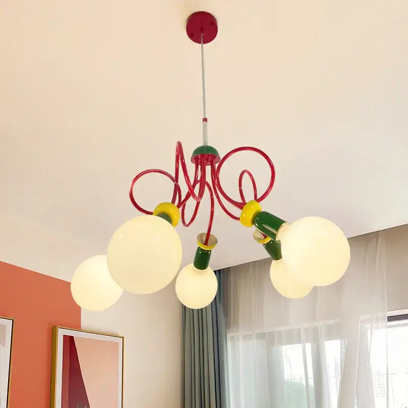 A colorful led floor lamp with curved metal arms and four glowing white bulbs in red green and yellow decorbites colorful led design