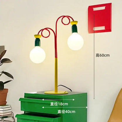 Vibrant red and yellow metal floor lamp with two exposed bulbs from decorbites colorful led floor collection for bedroom decor