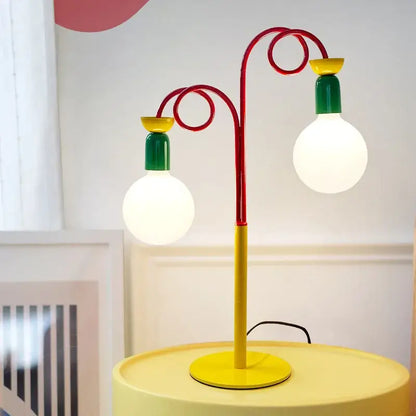 Vibrant red yellow and green colorful led floor lamp with two curved metal arms and bulb holders for decorbites colorful led