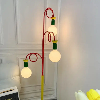 A whimsical yellow red and green colorful led floor lamp with three glowing globe bulbs for decorbites colorful led decor