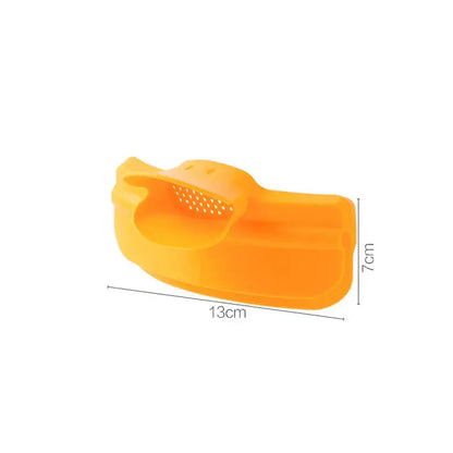 Bright orange silicone fruit peeler with perforated surface and ergonomic handle for decorbites duck beak funnel use