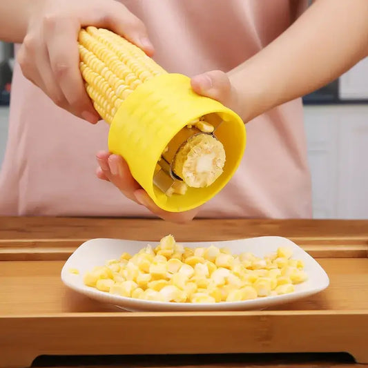 Yellow textured grip corn peeler tool with metal cutting mechanism for easy kitchen kernel removal by decorbites corn peeler