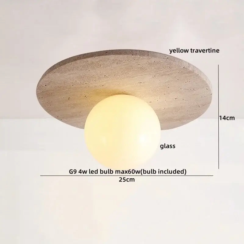 A modern ceiling light with a circular yellow travertine base and warm spherical glass globe led decorbites yellow