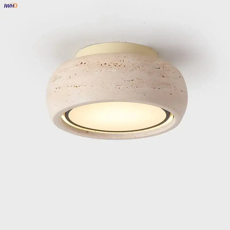 Beige textured concrete flush mount ceiling light with a warm glow for bedroom featuring yellow travertine decorbites led yellow
