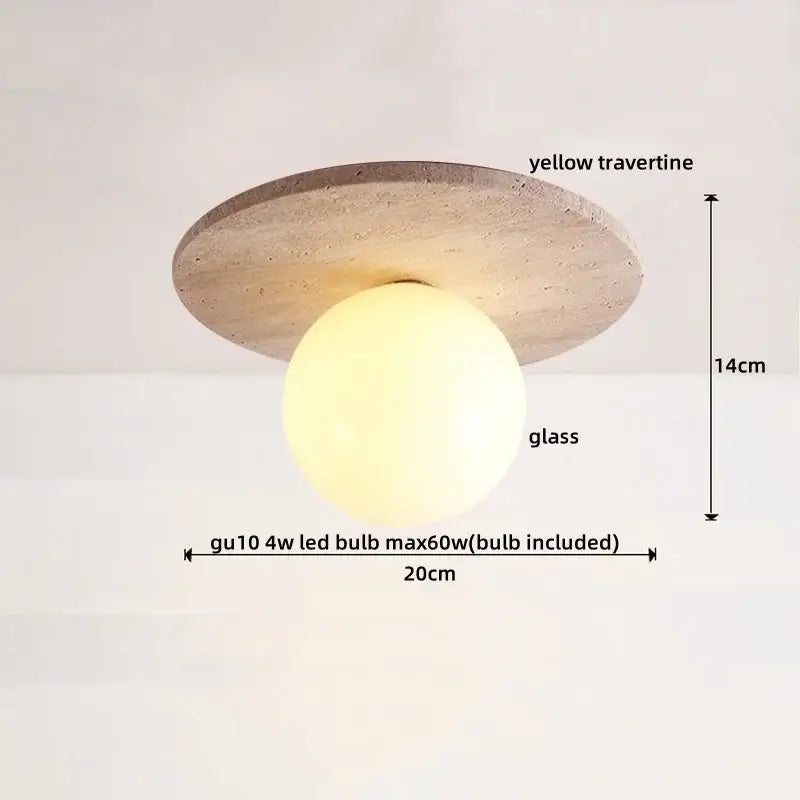 A modern ceiling light with a circular yellow travertine base and a spherical glass globe decorbites led yellow design