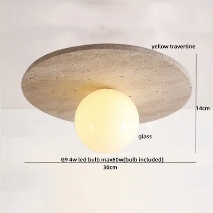 A modern ceiling light with a circular yellow travertine stone base and central glass globe decorbites led yellow