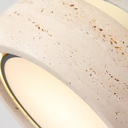 Cream-colored stone wall sconce with gold-toned trim complementing yellow travertine ceiling light decorbites led yellow