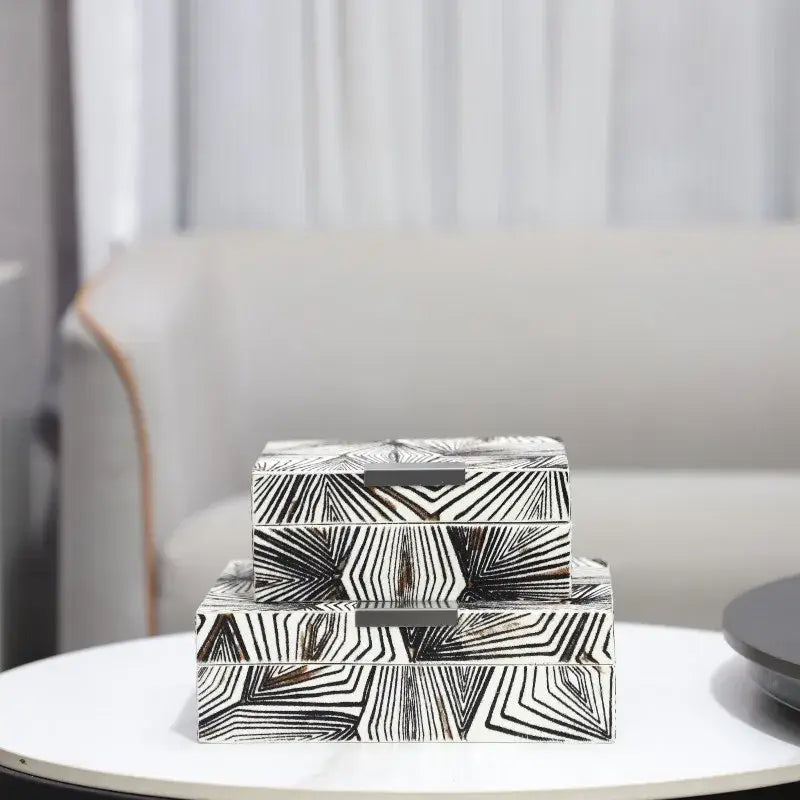 Stacked zebra black and white jewelry storage box with geometric patterns and metallic handles for desktop storage