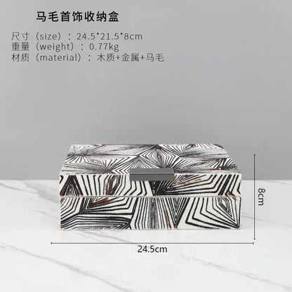 Zebra black and white jewelry storage box with geometric pattern and metallic clasp for desktop organization