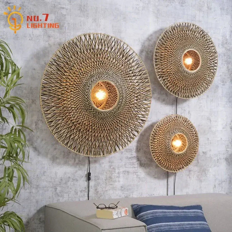 Three circular bamboo weaving wall lamps with warm glowing bulbs for living room zen natural wall lamp decor