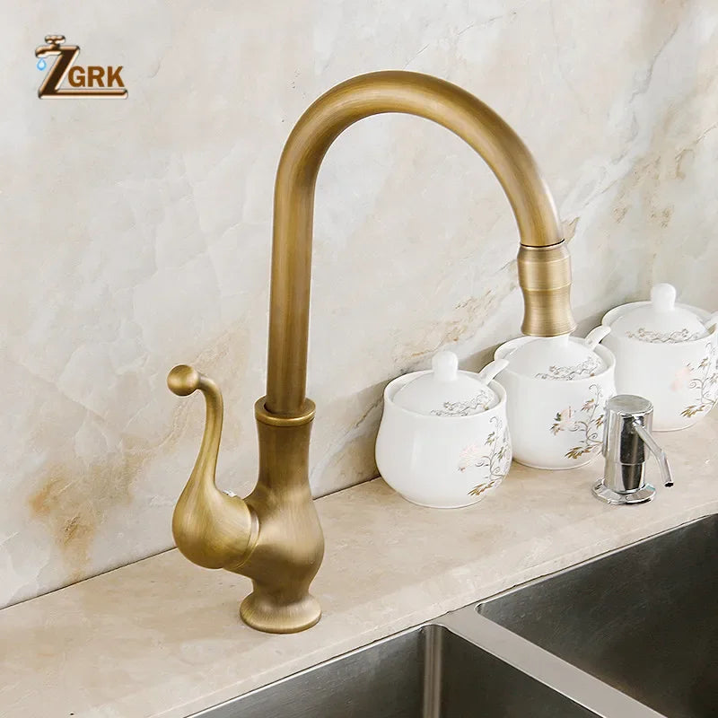 Antique brass kitchen faucet with curved spout and ornate handle deck mounted single hole mixer tap with brass housing material